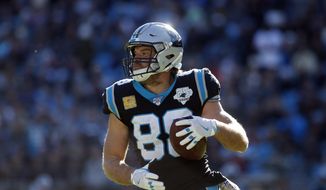 Carolina Panthers tight end Greg Olsen (88) runs the ball during the first half of an NFL football game against the Atlanta Falcons in Charlotte, N.C., Sunday, Nov. 17, 2019. (AP Photo/Brian Blanco) ** FILE **