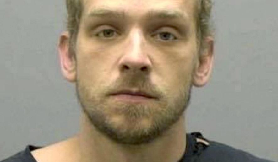 This Sunday, Nov. 17, 2019 booking photo released by the Burlington (North Carolina) Police Department shows William Lawrence Cowan. A homeowner with a shotgun fended off Cowan, who police say tried to break into the home using an ax. A news release from Burlington police says Cowan tried to enter the house through a back door on Sunday morning, with an ax that belonged to the homeowner. (Burlington Police Department via AP)