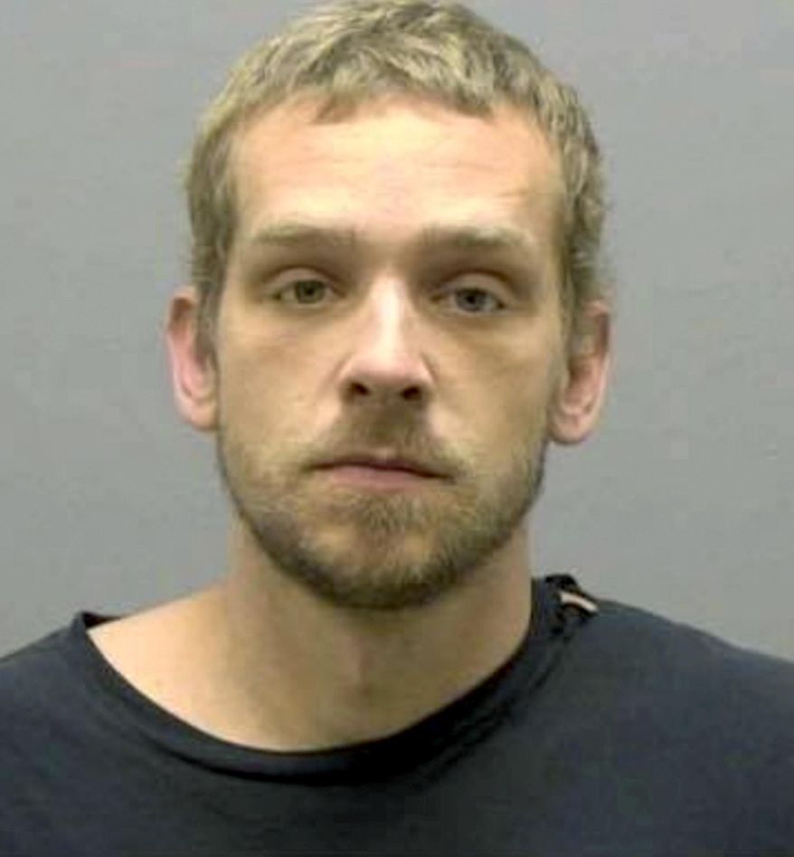 This Sunday, Nov. 17, 2019 booking photo released by the Burlington (North Carolina) Police Department shows William Lawrence Cowan. A homeowner with a shotgun fended off Cowan, who police say tried to break into the home using an ax. A news release from Burlington police says Cowan tried to enter the house through a back door on Sunday morning, with an ax that belonged to the homeowner. (Burlington Police Department via AP)