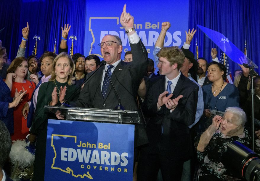 FILE - In this Saturday, Nov. 16, 2019 file photo, Louisiana Gov. John Bel Edwards arrives to address supporters at his election night watch party in Baton Rouge, La. A re-election victory by Edwards has assured Democrats of an all-important place at the table when political maps are redrawn after the 2020 census for future elections to Congress and the state legislature. Edwards’ narrow triumph on Saturday marked the third significant win in a Southern state in two weeks for Democrats, following their takeover of the Virginia General Assembly and the defeat of Republican Kentucky Gov. Matt Bevin by Democratic Attorney General Andy Beshear. (AP Photo/Matthew Hinton, File)