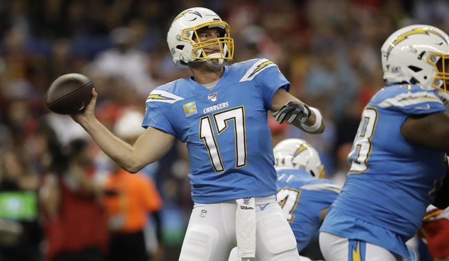 Los Angeles Chargers quarterback Philip Rivers throws a pass during the first half of an NFL football game against the Kansas City Chiefs Monday, Nov. 18, 2019, in Mexico City. (AP Photo/Marcio Jose Sanchez)