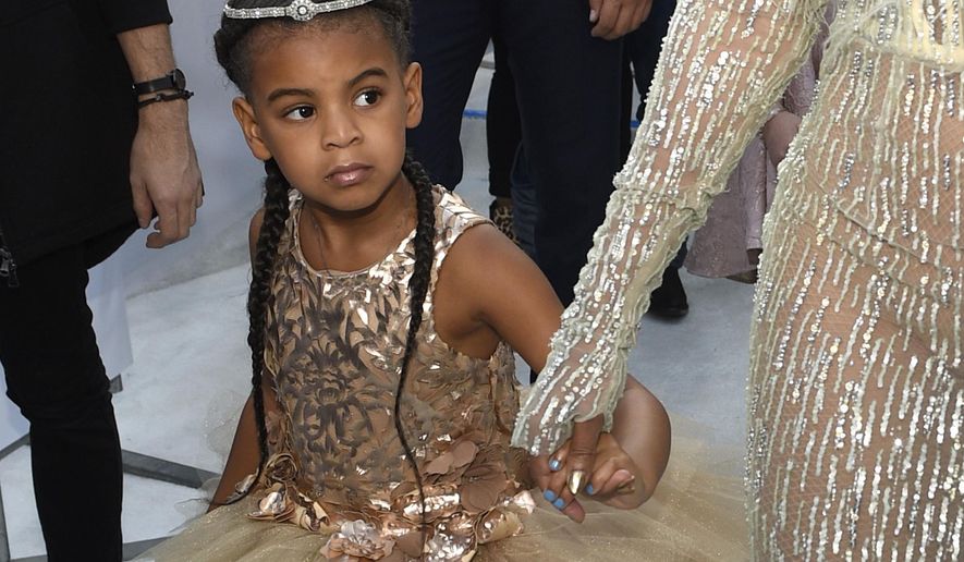 FILE - In this Aug. 28, 2016 file photo, Blue Ivy, daughter of Beyonce, arrives at the MTV Video Music Awards at Madison Square Garden in New York. At just 7, Blue Ivy Carter is an award-winning songwriter. Jay-Z and Beyoncé’s daughter won the Ashford & Simpson Songwriter’s Award at the Soul Train Awards on Sunday, Nov 17, 2019, for co-writing her mom’s hit “Brown Skin Girl,” a song celebrating dark- and brown-skinned women. Ivy gives a vocal performance that opens and closes the song, which also features Wizkid and Saint Jhn.(Photo by Chris Pizzello/Invision/AP, File)