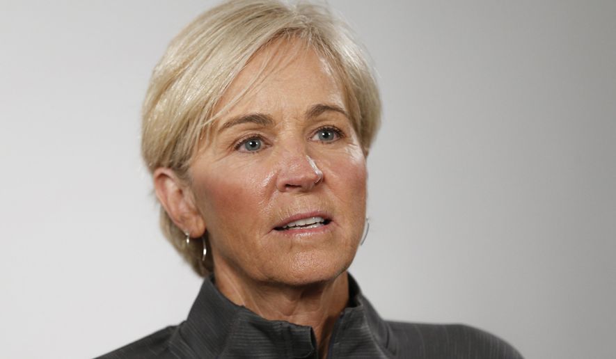 FILE - In this Oct. 3, 2019, file photo, Georgia Tech coach Nell Fortner answers a question during the Atlantic Coast Conference women's NCAA college basketball media day in Charlotte, N.C. The Bobcats went into Columbus on Sunday, Nov. 17, 2019 and beat Ohio State 74-68 for the first time in school history. The Yellow Jackets (3-0) have only won seven of the 42 meetings between the schools. (AP Photo/Nell Redmond, File)