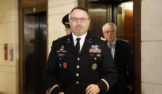 In this Oct. 29, 2019, file photo, Army Lt. Col. Alexander Vindman, a military officer at the National Security Council, center, arrives on Capitol Hill in Washington. (AP Photo/Patrick Semansky, File)