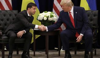 FILE - In this Sept. 25, 2019, file photo, President Donald Trump meets with Ukrainian President Volodymyr Zelenskiy at the InterContinental Barclay New York hotel during the United Nations General Assembly in New York.  (AP Photo/Evan Vucci, File)