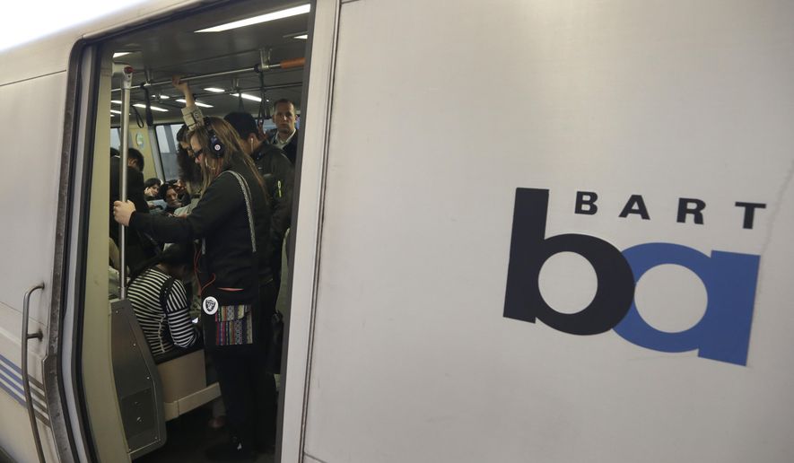 FILE - In this Oct. 22, 2013, file photo, Bay Area Rapid Transit passengers wait for a BART train to depart the Fruitvale station in Oakland, Calif. A California transit chief said a man was stabbed to death Tuesday, Nov. 19, 2019, during a fight between two men on a San Francisco Bay Area commuter train. (AP Photo/Ben Margot, File)