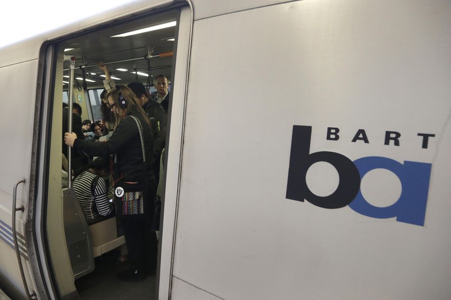 FILE - In this Oct. 22, 2013, file photo, Bay Area Rapid Transit passengers wait for a BART train to depart the Fruitvale station in Oakland, Calif. A California transit chief said a man was stabbed to death Tuesday, Nov. 19, 2019, during a fight between two men on a San Francisco Bay Area commuter train. (AP Photo/Ben Margot, File)