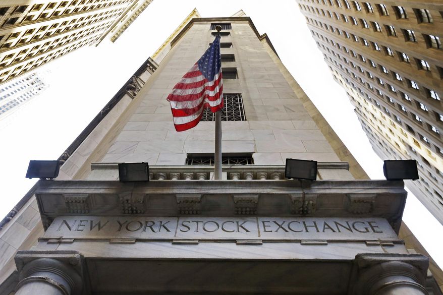 In this Friday, Nov. 13, 2015, photo, the American flag flies above the Wall Street entrance to the New York Stock Exchange, in New York. U.S. stocks wobbled between small gains and losses Tuesday, Nov. 19, 2019, as investors paused following another record-setting day. The major indexes have been steadily rising and setting records for weeks as a mix of solid economic data and corporate earnings inject confidence into the market. Worries about a potential recession have faded and investors are now closely watching for any developments in trade talks between the U.S. and China. (AP Photo/Richard Drew, File)