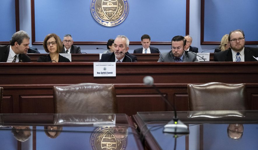 Chairman Garth Everett, R-Lycoming, center, speaks during a House State Government Committee hearing on new limits for public officials taking gifts at the Pennsylvania Capitol in Harrisburg, Pa., Tuesday, Nov. 19, 2019. The bill would ban cash gifts outright and put limits on other gifts and hospitality. It was sent to the House floor unanimously. (AP Photo/Matt Rourke)
