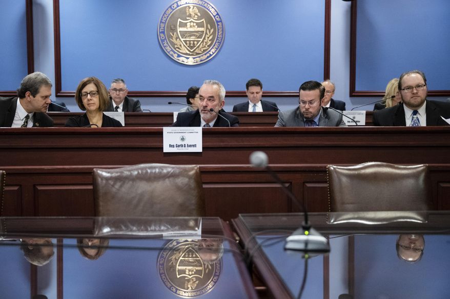 Chairman Garth Everett, R-Lycoming, center, speaks during a House State Government Committee hearing on new limits for public officials taking gifts at the Pennsylvania Capitol in Harrisburg, Pa., Tuesday, Nov. 19, 2019. The bill would ban cash gifts outright and put limits on other gifts and hospitality. It was sent to the House floor unanimously. (AP Photo/Matt Rourke)