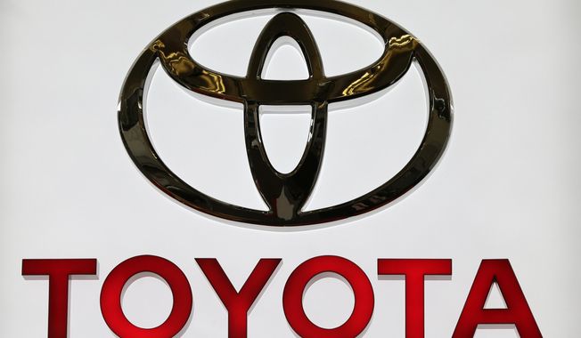 This photo taken Feb. 14, 2013, shows the Toyota logo on a sign at the Pittsburgh Auto Show in Pittsburgh. Toyota says it hopes to prevent further cases after authorities ruled that one of its engineers killed himself after being repeatedly ridiculed by his boss. The company acknowledged the case, reported Tuesday, Nov. 19, 2019. (AP Photo/Gene J. Puskar)