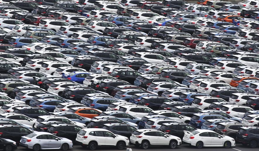 In this July 8, 2019, photo, Subaru cars for export park at Kawasaki port, near Tokyo. Japan has recorded a trade surplus in October, the first surplus in four months, as exports to the U.S. fell and oil prices slipped, according to a report on Wednesday, Nov. 20, 2019. (AP Photo/Koji Sasahara)
