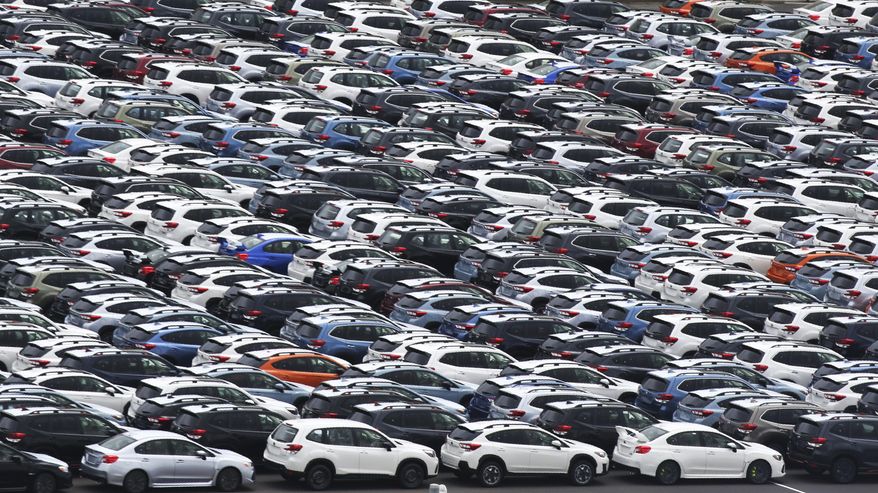 In this July 8, 2019, photo, Subaru cars for export park at Kawasaki port, near Tokyo. Japan has recorded a trade surplus in October, the first surplus in four months, as exports to the U.S. fell and oil prices slipped, according to a report on Wednesday, Nov. 20, 2019. (AP Photo/Koji Sasahara)