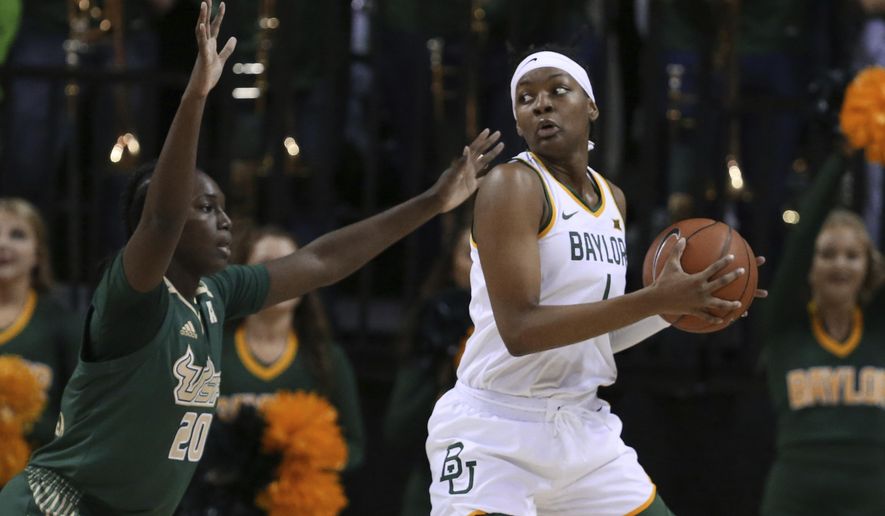 Baylor forward NaLyssa Smith, right, looks to the basket over South Florida forward Bethy Mununga, left, in the first half of an NCAA college basketball game, Tuesday, Nov. 19, 2019, in Waco, Texas. (AP Photo/Rod Aydelotte)