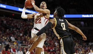 Iowa State guard Tyrese Haliburton (22) drives to the basket over Southern Mississippi guard Gabe Watson, right, during the first half of an NCAA college basketball game, Tuesday, Nov. 19, 2019, in Ames, Iowa. (AP Photo/Charlie Neibergall)