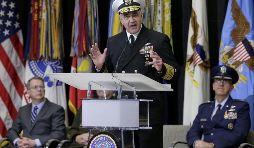 Vice Adm. Charles A. Richard, new commander of US Strategic Command, speaks during a change of command ceremony at Offutt AFB in Nebraska, Monday, Nov. 18, 2019, with Deputy Secretary of Defense David Norquist, left, and Air Force Gen. John Hyten, outgoing commander of US Strategic Command, right. A dedication ceremony was also held for C2F, US Strategic Command's new command and control facility. (AP Photo/Nati Harnik)