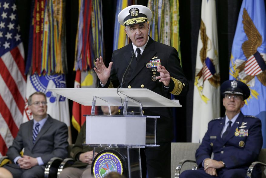 Vice Adm. Charles A. Richard, new commander of US Strategic Command, speaks during a change of command ceremony at Offutt AFB in Nebraska, Monday, Nov. 18, 2019, with Deputy Secretary of Defense David Norquist, left, and Air Force Gen. John Hyten, outgoing commander of US Strategic Command, right. A dedication ceremony was also held for C2F, US Strategic Command's new command and control facility. (AP Photo/Nati Harnik)