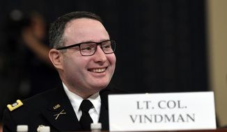Then-National Security Council aide Lt. Col. Alexander Vindman testifies before the House Intelligence Committee on Capitol Hill in Washington, Tuesday, Nov. 19, 2019, during a public impeachment hearing of President Donald Trump&#x27;s efforts to tie U.S. aid for Ukraine to investigations of his political opponents.  (AP Photo/Susan Walsh)  **FILE**