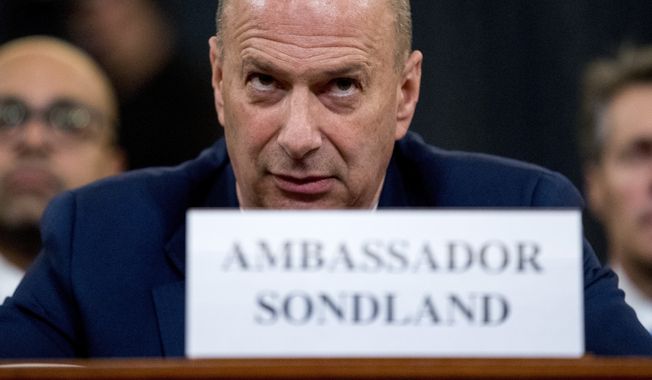 Ambassador Gordon Sondland, U.S. Ambassador to the European Union, center, appears before the House Intelligence Committee on Capitol Hill in Washington, Wednesday, Nov. 20, 2019, during a public impeachment hearing of President Donald Trump&#x27;s efforts to tie U.S. aid for Ukraine to investigations of his political opponents. (AP Photo/Andrew Harnik)