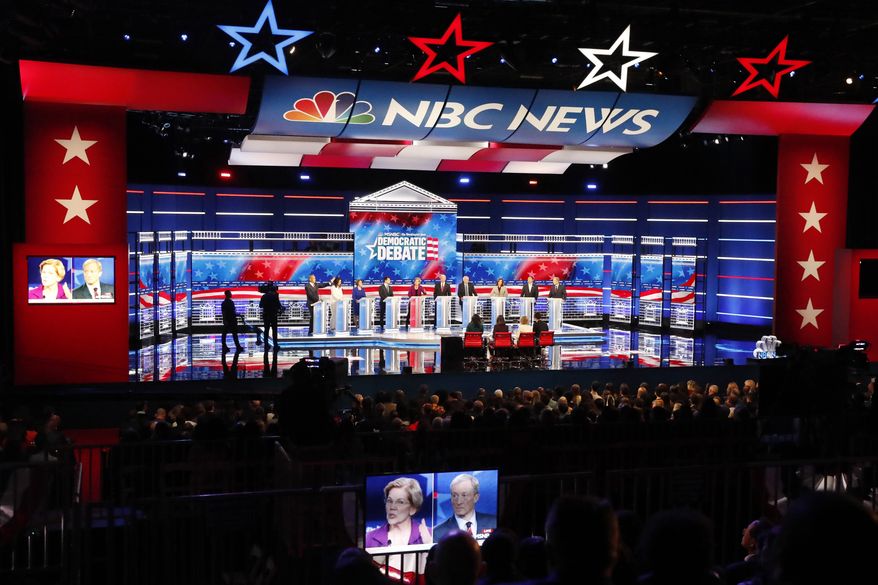 Democratic presidential candidates from left, Sen. Cory Booker, D-N.J., Rep. Tulsi Gabbard, D-Hawaii, Sen. Amy Klobuchar, D-Minn., South Bend, Ind., Mayor Pete Buttigieg, Sen. Elizabeth Warren, D-Mass., former Vice President Joe Biden, Sen. Bernie Sanders, I-Vt., Sen. Kamala Harris, D-Calif., former technology executive Andrew Yang and investor Tom Steyer participate in a Democratic presidential primary debate, Wednesday, Nov. 20, 2019, in Atlanta. (AP Photo/John Bazemore)