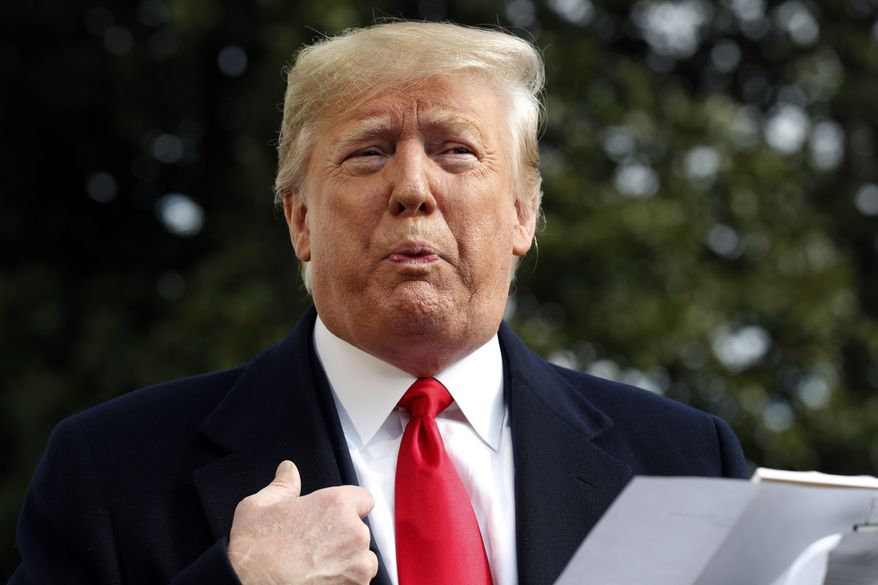President Donald Trump talks to the media on his way to the Marine One helicopter, Wednesday, Nov. 20, 2019, as he leaves the White House in Washington, en route to Texas. (AP Photo/Jacquelyn Martin)