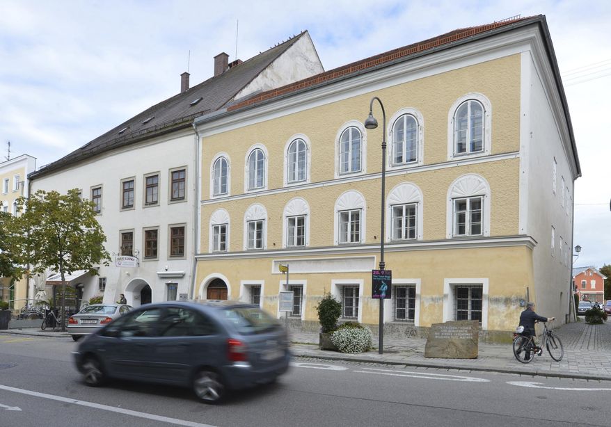 FILE - This Sept. 27, 2012 file picture shows an exterior view of Adolf Hitler's birth house , front, in Braunau am Inn, Austria. Austrian authorities say the house where Adolf Hitler was born in 1889 will become a police precinct, ending years of uncertainty over the building that's become a pilgrimage site for people who glorify the Nazi dictator. (AP Photo / Kerstin Joensson)
