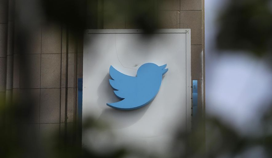 FILE - This July 9, 2019, file photo shows a sign outside of the Twitter office building in San Francisco. Social media companies have vowed to tackle misinformation in politics. Social media companies have vowed to tackle misinformation in politics. But when Britain's Conservative Party changed its press office Twitter account Tuesday, Nov. 19, to look like a fact-checking site during a televised debate, the only consequence was a promise from Twitter to take action if they did it again. (AP Photo/Jeff Chiu, File)