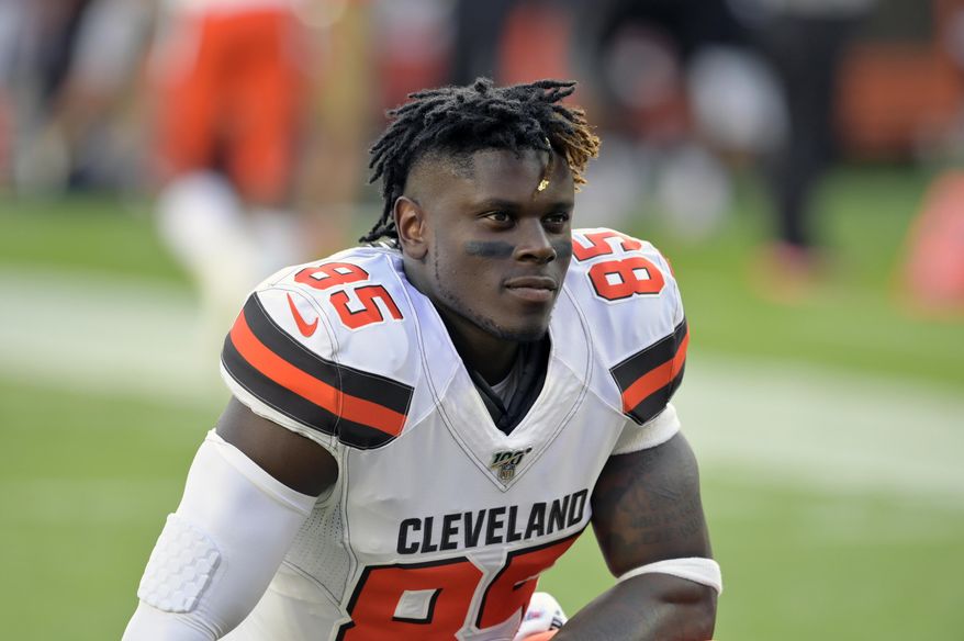 FILE - In this Aug. 8, 2019, file photo, Cleveland Browns tight end David Njoku kneels on the field before an NFL preseason football game against the Washington Redskins, in Cleveland. Njoku has returned to practice after missing eight games with a broken right wrist. Njoku was injured in Cleveland’s win over the New York Jets on Sept. 16. The Browns designated Njoku for return from injured reserve on Wednesday, Nov. 20, 2019. (AP Photo/David Richard, File)