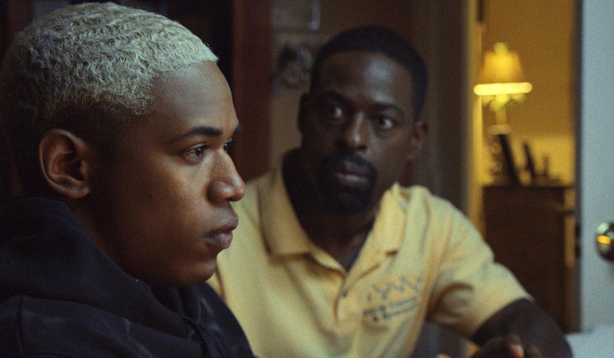 This image released by A24 shows Kelvin Harrison Jr., left, and Sterling K. Brown in a scene from "Waves." (A24 via AP)