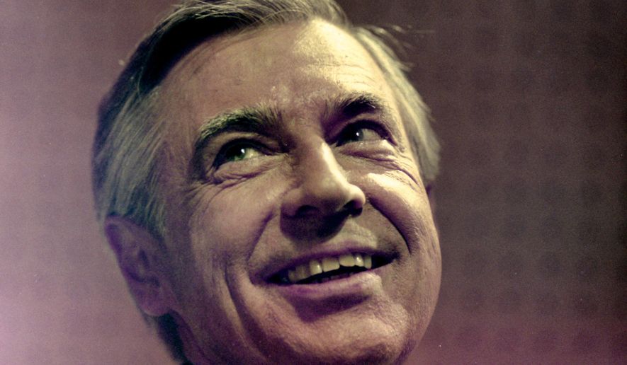 This photo shows Fred Rogers between takes on a segment of his television program "Mister Rogers' Neighborhood" in Pittsburgh on June 8, 1993. (AP Photo/Gene J. Puskar)