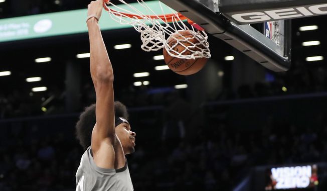 Brooklyn Nets center Jarrett Allen dunks during the second half of the team&#x27;s NBA basketball game against the Charlotte Hornets, Wednesday, Nov. 20, 2019, in New York. (AP Photo/Kathy Willens)