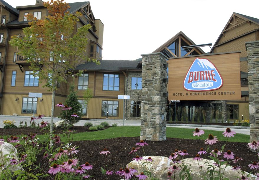 FILE - In this Sept. 1, 2016, file photo, the Lodge at Burke Mountain is pictured on the day it officially opened in East Burke, Vt. Foreigners who invested in the Jay Peak and Burke Mountain ski area developments that are now linked to alleged fraud say the federal government is declining to act on their petitions for U.S. residency. A federal lawsuit filed in Florida on Friday, Nov. 13, 2019, accuses the U.S. Citizenship and Immigration Services of leaving their residency petitions in limbo. The agency declined comment. (AP Photo/Lisa Rathke, File)