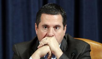 Ranking member Rep. Devin Nunes of Calif., listens as Ambassador Kurt Volker, former special envoy to Ukraine, and Tim Morrison, a former official at the National Security Council, testify before the House Intelligence Committee on Capitol Hill in Washington, Tuesday, Nov. 19, 2019, during a public impeachment hearing of President Donald Trump&#39;s efforts to tie U.S. aid for Ukraine to investigations of his political opponents. (AP Photo/Jacquelyn Martin, Pool)