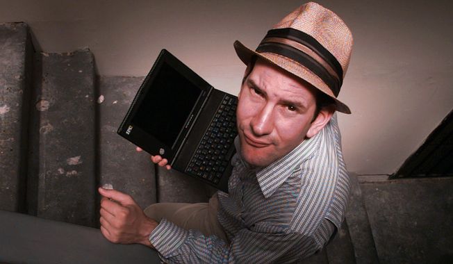 Matt Drudge carries a laptop computer as he walks up the stairs at his Hollywood-area apartment in Los Angeles on June 18, 1997. The Drudge Report, the daily barrage of breaking news, gossip and politics he e-mails to some 65,000 subscribers, is hotter than hot. (AP Photo/Michael Caulfield) ** FILE **