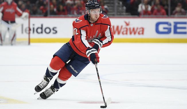 Washington Capitals center Travis Boyd (72) skates with the puck during the second period of an NHL hockey game against the Anaheim Ducks, Monday, Nov. 18, 2019, in Washington. (AP Photo/Nick Wass) ** FILE **
