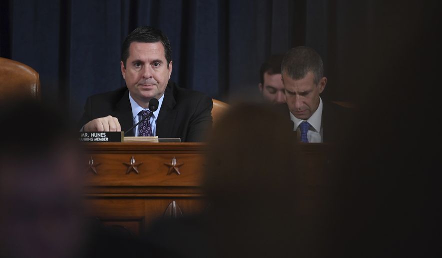 Ranking member Rep. Devin Nunes of Calif., left,  waits for former White House national security aide Fiona Hill, right, and David Holmes, a U.S. diplomat in Ukraine, to testify before the House Intelligence Committee on Capitol Hill in Washington, Thursday, Nov. 21, 2019, during a public impeachment hearing of President Donald Trump&#39;s efforts to tie U.S. aid for Ukraine to investigations of his political opponents. (Matt McClain/Pool Photo via AP)