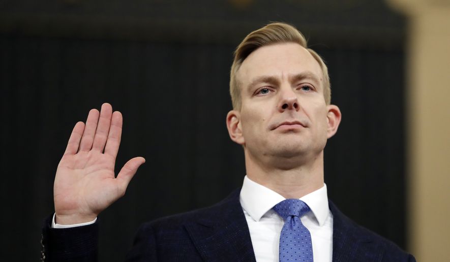 David Holmes, a U.S. diplomat in Ukraine, is sworn in to testify before the House Intelligence Committee on Capitol Hill in Washington, Thursday, Nov. 21, 2019, during a public impeachment hearing of President Donald Trump&#x27;s efforts to tie U.S. aid for Ukraine to investigations of his political opponents. (AP Photo/Andrew Harnik)