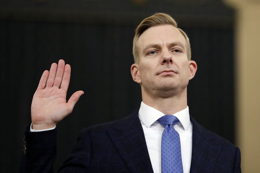 David Holmes, a U.S. diplomat in Ukraine, is sworn in to testify before the House Intelligence Committee on Capitol Hill in Washington, Thursday, Nov. 21, 2019, during a public impeachment hearing of President Donald Trump&#x27;s efforts to tie U.S. aid for Ukraine to investigations of his political opponents. (AP Photo/Andrew Harnik)