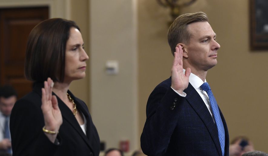 Former White House national security aide Fiona Hill, and David Holmes, a U.S. diplomat in Ukraine, are sworn in to testify before the House Intelligence Committee on Capitol Hill in Washington, Thursday, Nov. 21, 2019, during a public impeachment hearing of President Donald Trump&#x27;s efforts to tie U.S. aid for Ukraine to investigations of his political opponents.(AP Photo/Susan Walsh)