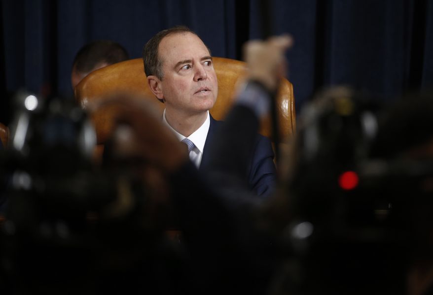 House Intelligence Committee Chairman Adam Schiff, D-Calif., listens as Former White House national security aide Fiona Hill, right, and David Holmes, a U.S. diplomat in Ukraine, testify before the House Intelligence Committee on Capitol Hill in Washington, Thursday, Nov. 21, 2019, during a public impeachment hearing of President Donald Trump's efforts to tie U.S. aid for Ukraine to investigations of his political opponents. (Andrew Harrer/Pool via AP)