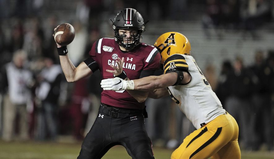 South Carolina quarterback Ryan Hilinski is sacked by Appalachian State linebacker Jordan Fehr (59) in the second half of an NCAA college football game in Columbia, S.C., Saturday, Nov. 9, 2019. (Dwayne McLemore/The State via AP)