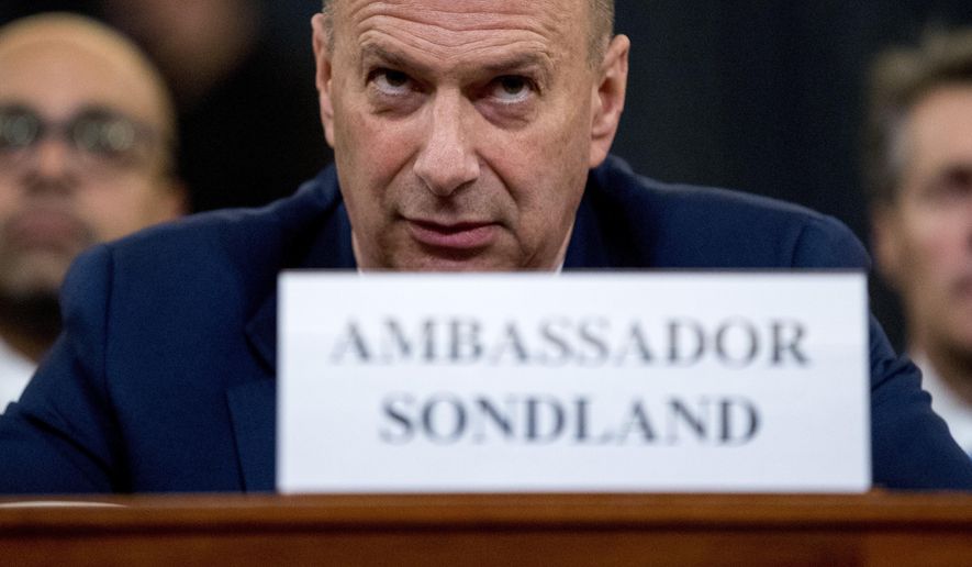 Gordon Sondland, U.S. ambassador to the European Union, center, appears before the House Intelligence Committee on Capitol Hill in Washington, Wednesday, Nov. 20, 2019, during a public impeachment hearing of President Donald Trump&#39;s efforts to tie U.S. aid for Ukraine to investigations of his political opponents. (AP Photo/Andrew Harnik)