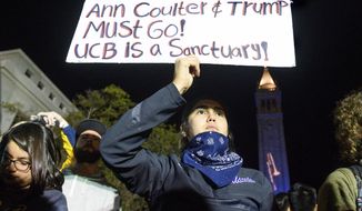 University of California, Berkeley student Magaly Mercado holds a protest sign as attendees leave a speech by conservative commentator Ann Coulter on Wednesday, Nov. 20, 2019, in Berkeley, Calif. Hundreds of demonstrators gathered on campus as Coulter delivered a talk titled &amp;quot;Adios, America!&amp;quot; (AP Photo/Noah Berger)