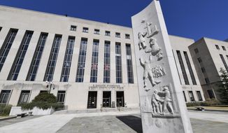 In this Oct. 11, 2019 file photo, a view of the E. Barrett Prettyman United States Courthouse in Washington. (AP Photo/Susan Walsh) **FILE**