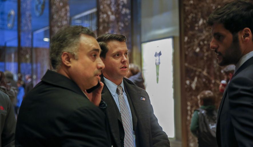 FILE - In this Dec. 12, 2016 file photo, Los Angeles venture capitalist Imaad Zuberi, far left, arrives at Trump Tower in New York. Federal prosecutors in New York have informed Zuberi, a major donor to President Donald Trump’s inaugural committee, that they intend to charge him with obstruction of justice and failing to register as a foreign agent. Attorneys for Zuberi filed papers late Thursday, Nov. 21, 2019, seeking a continuance of Zuberi&#39;s court proceedings in Los Angeles. (AP Photo/Kathy Willens, File)
