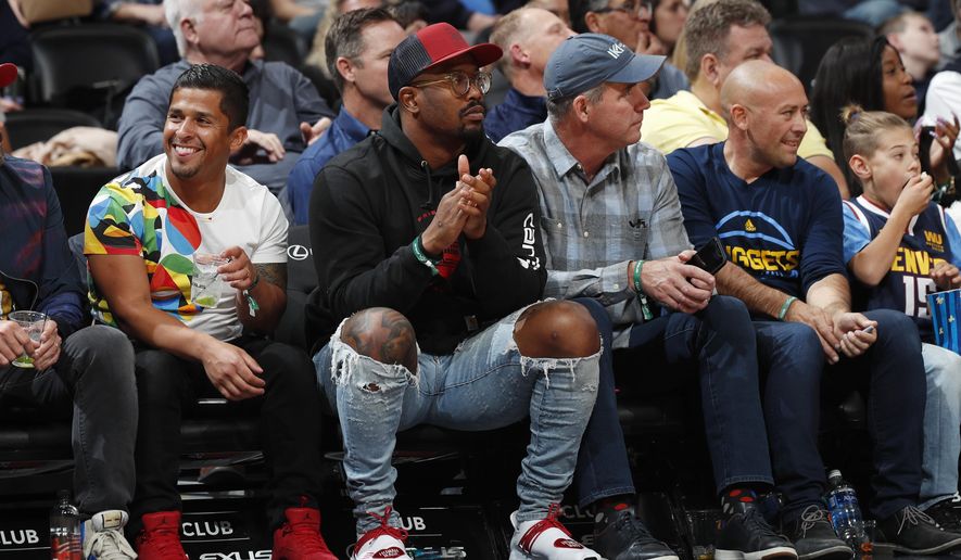 Denver Broncos linebacker Von MIller watches the Denver Nuggets play the Atlanta Hawks duringthe first half of an NBA basketball game Tuesday, Nov. 12, 2019, in Denver. (AP Photo/David Zalubowski)