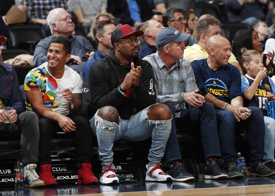 Denver Broncos linebacker Von MIller watches the Denver Nuggets play the Atlanta Hawks duringthe first half of an NBA basketball game Tuesday, Nov. 12, 2019, in Denver. (AP Photo/David Zalubowski)