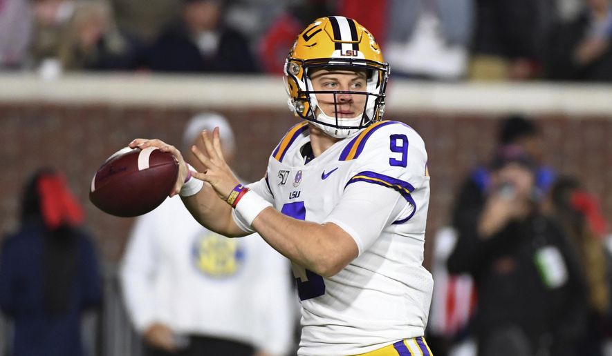 LSU quarterback Joe Burrow looks for a receiver during the first half of the team&#39;s NCAA college football game against Mississippi in Oxford, Miss., Saturday, Nov. 16, 2019. (AP Photo/Thomas Graning)