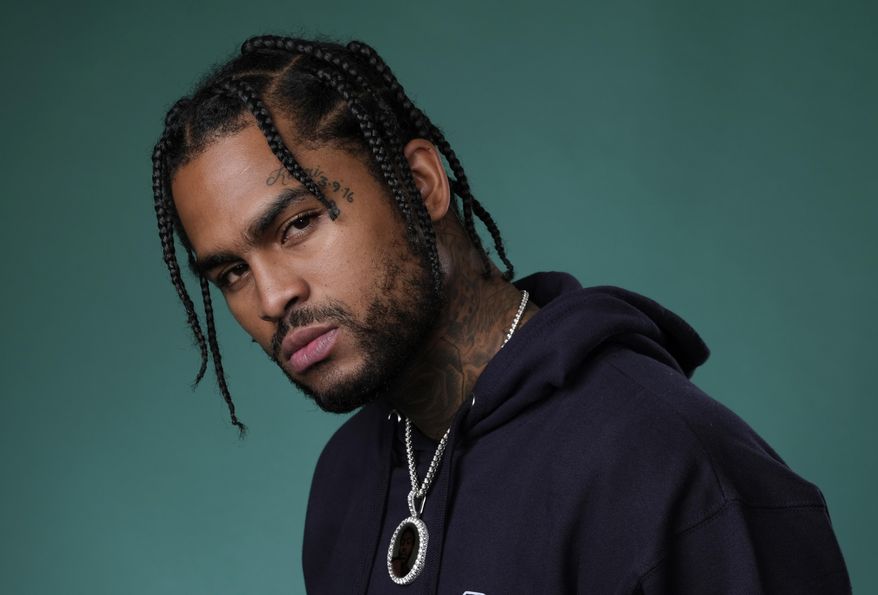FILE - This July 26, 2019 file photo shows rapper Dave East, a cast member in the Hulu series "Wu-Tang: An American Saga," posing for a portrait in Beverly Hills, Calif. “Survival,” which debuted at No. 11 on the Billboard Top 200 albums this week, is East’s official album debut, even though he’s been widely known in the hip-hop community for the past few years, releasing numerous popular mixtapes and EPs. He’s also collaborated with high profile artists such as Chris Brown, Meek Mill, 2 Chainz and Mac Miller. (Photo by Chris Pizzello/Invision/AP, File)