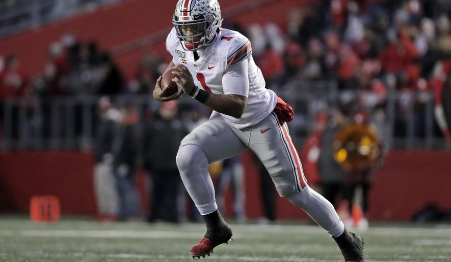 Ohio State quarterback Justin Fields (1) rushes against Rutgers during the first half of an NCAA college football game Saturday, Nov. 16, 2019, in Piscataway, N.J. (AP Photo/Adam Hunger)
